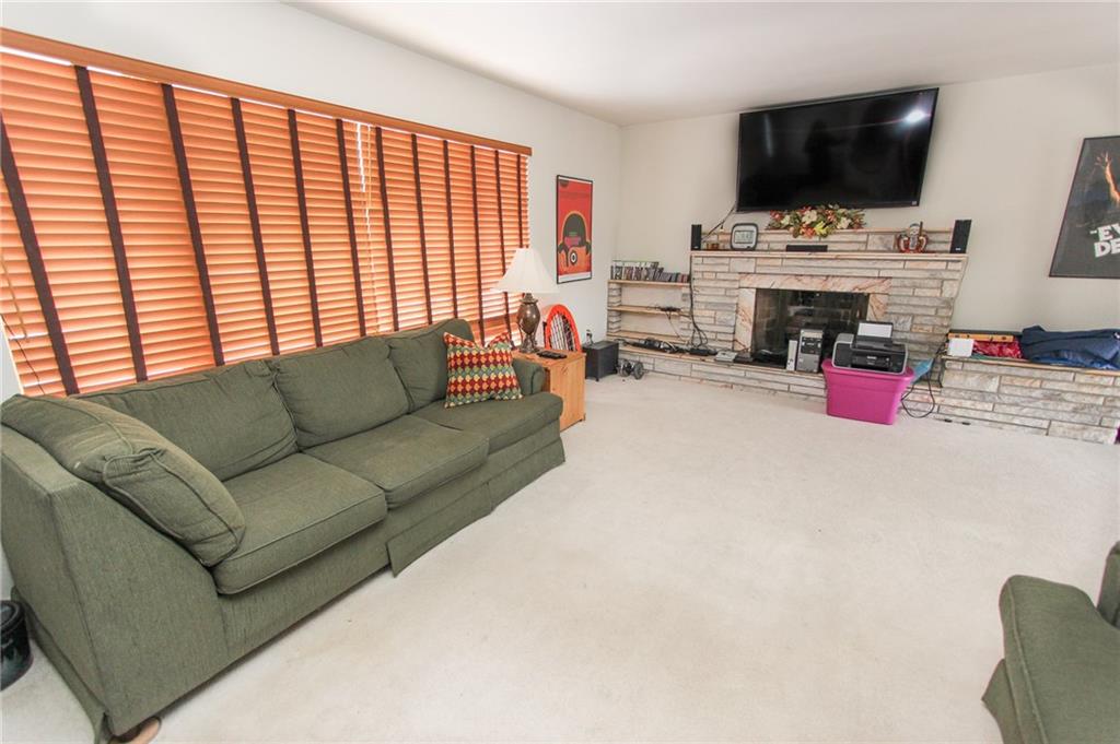 3083 Brodhead Road Aliquippa, PA 15001 - Photo 3 of 18 Good sized living room with beautiful fireplace.