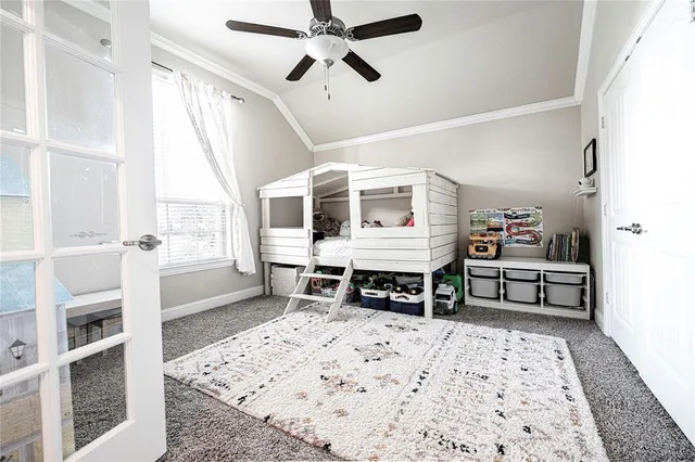 a bedroom with furniture and a window