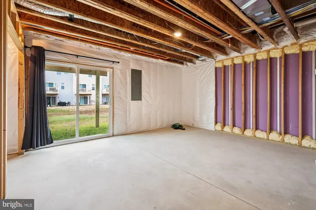 a view of an empty room with a sliding door
