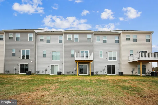 a front view of building with yard