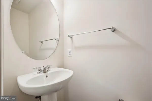a bathroom with a sink a mirror and a shower