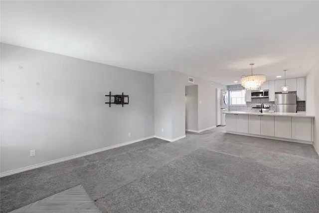 a view of a kitchen with a sink