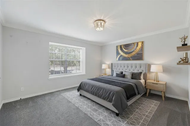 a bedroom with bed and a window