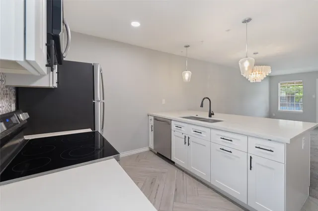 a spacious bathroom with a sink and a mirror