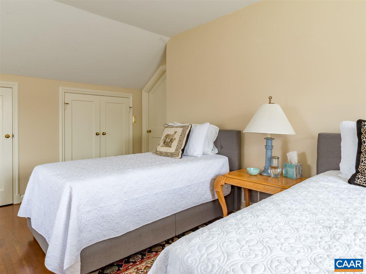 1968 Stony Point Road Charlottesville, VA 22911 - Photo 42 of 50 a bedroom with a bed and a lamp