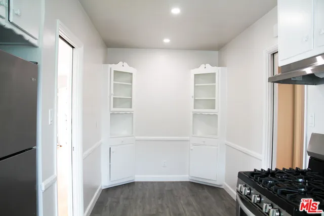 a view of cabinets and wooden floor