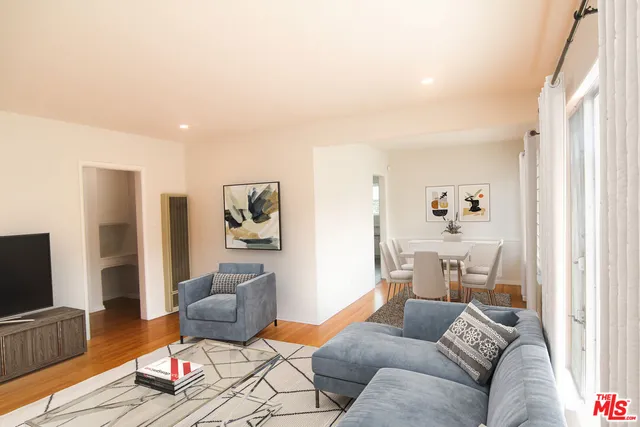 a view of hallway with wooden floor