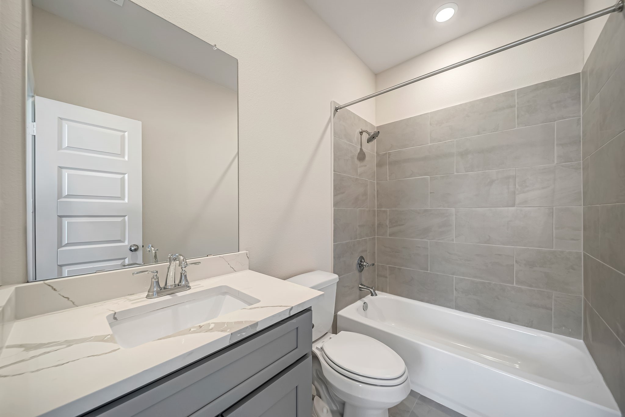 20629 Dynamic Court Humble, TX 77338 - Photo 21 of 26 a bathroom with a granite countertop bathtub shower sink mirror vanity and toilet