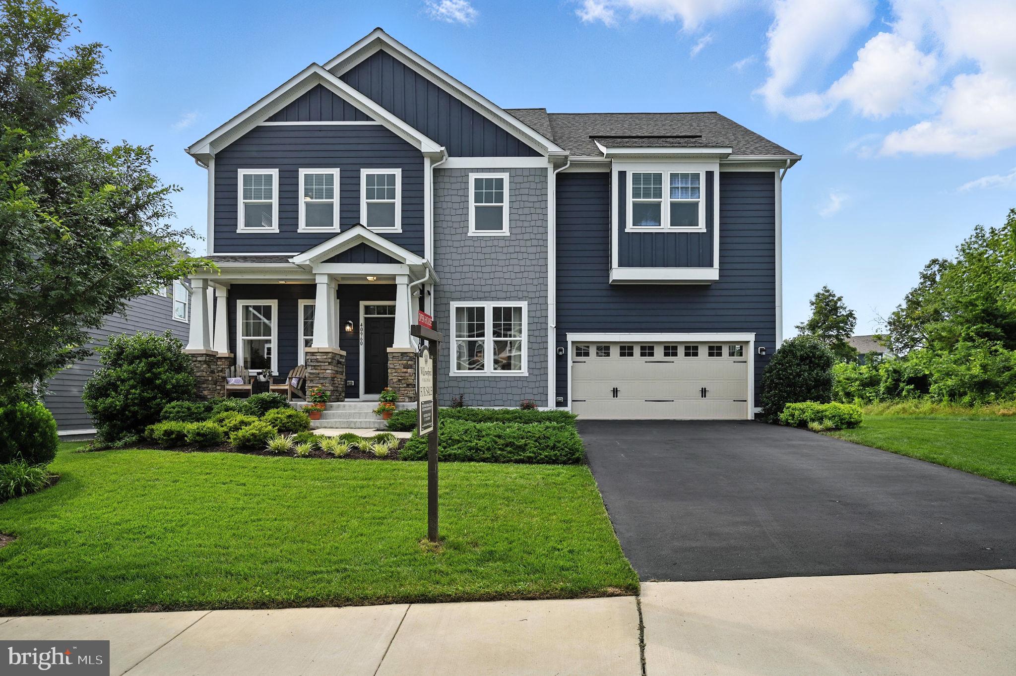 40960 River Cane Place Aldie, VA 20105 - Photo 1 of 54 a front view of a house with a yard