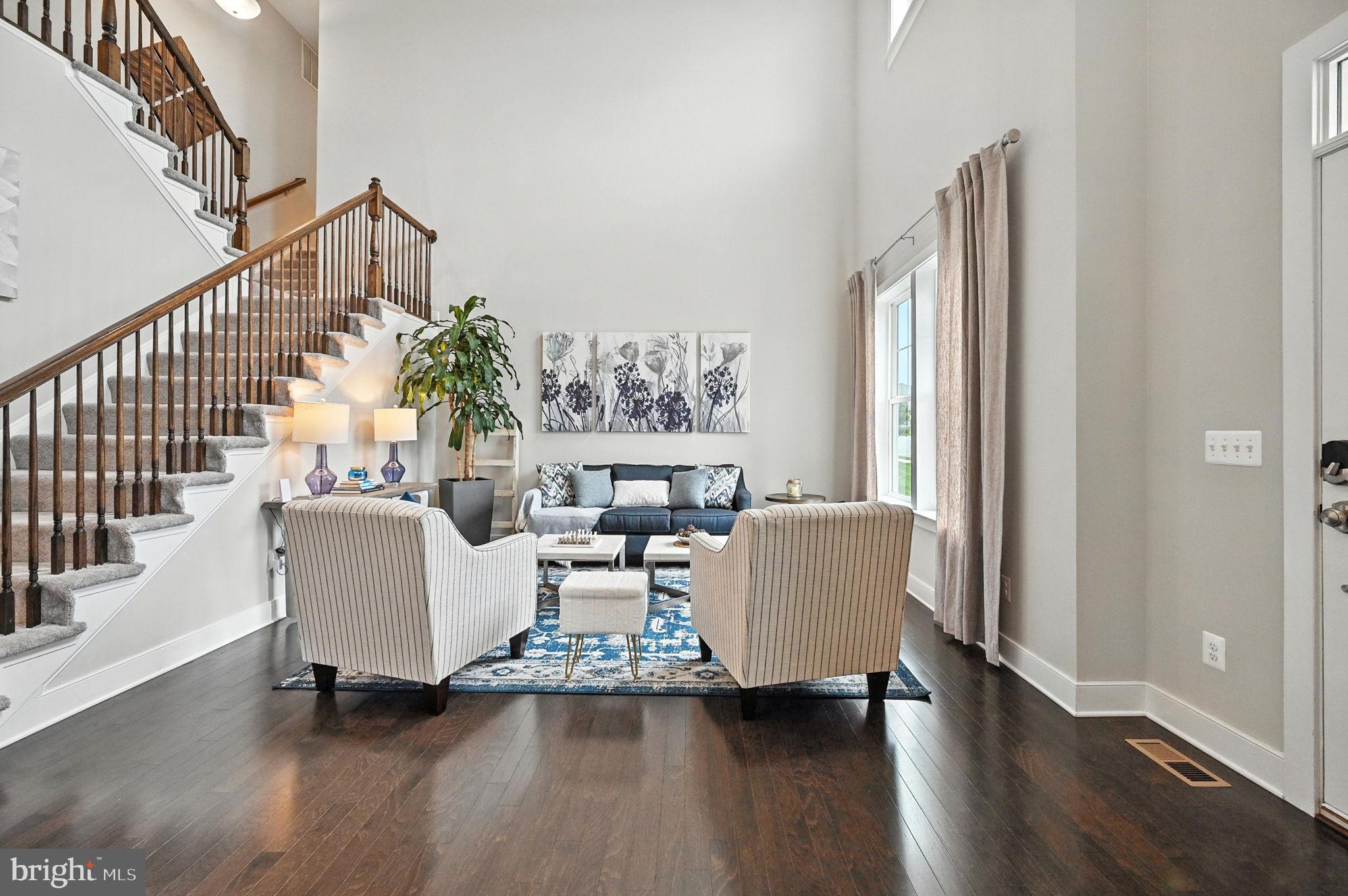40960 River Cane Place Aldie, VA 20105 - Photo 12 of 54 a living room with furniture and a large window