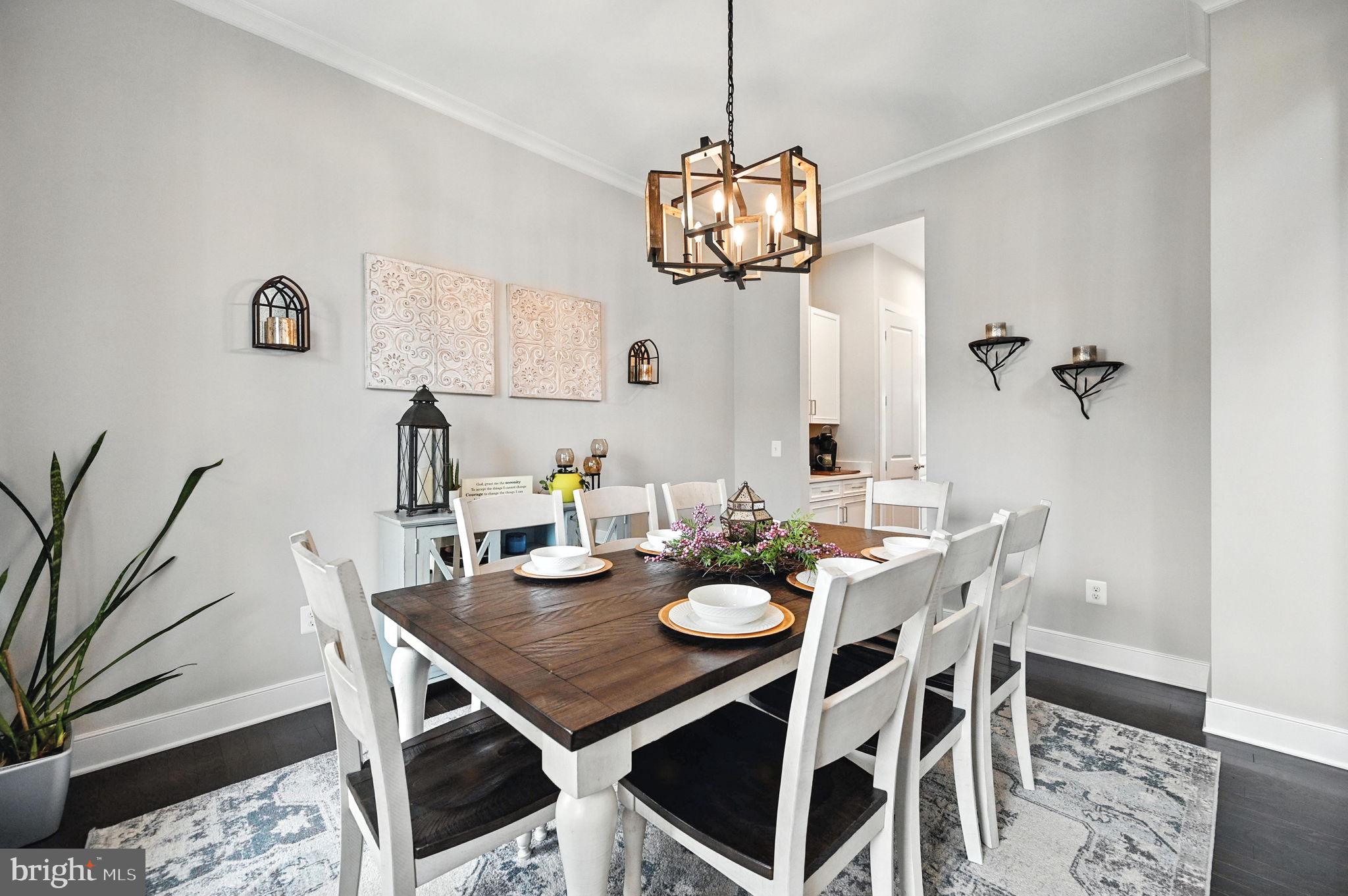 40960 River Cane Place Aldie, VA 20105 - Photo 16 of 54 a view of a dining room with furniture and wooden floor