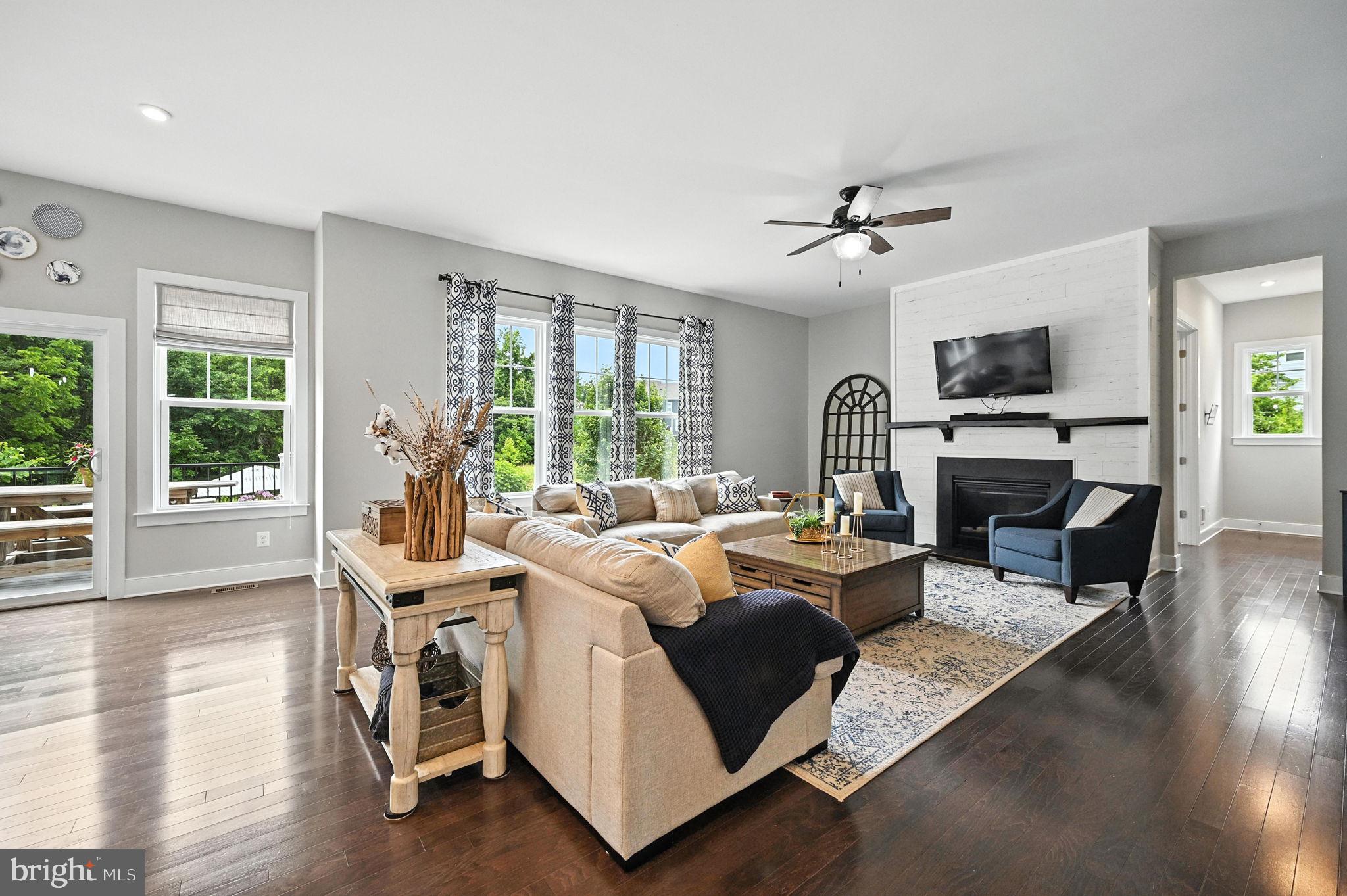 40960 River Cane Place Aldie, VA 20105 - Photo 17 of 54 a living room with furniture fireplace and flat screen tv