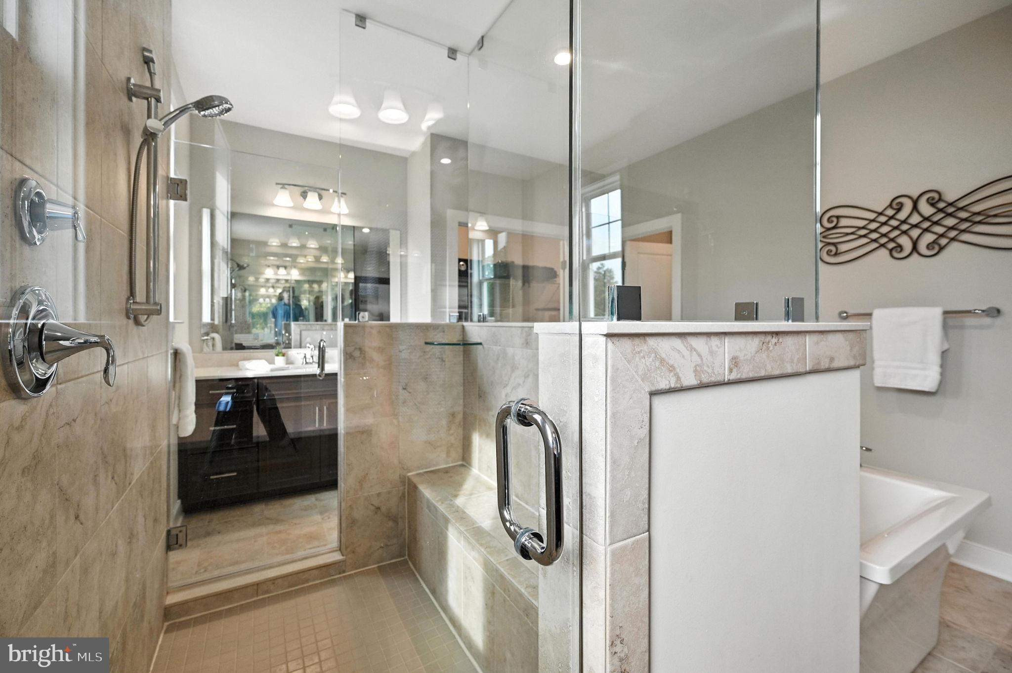 40960 River Cane Place Aldie, VA 20105 - Photo 22 of 54 a kitchen with stainless steel appliances granite countertop a refrigerator and a stove