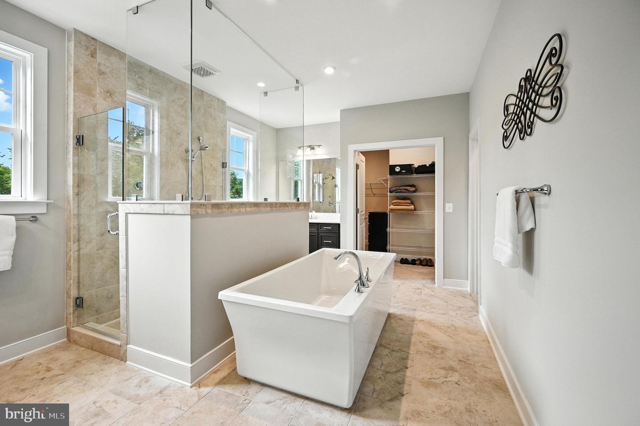 40960 River Cane Place Aldie, VA 20105 - Photo 23 of 54 a living room with stainless steel appliances furniture a rug and a kitchen view