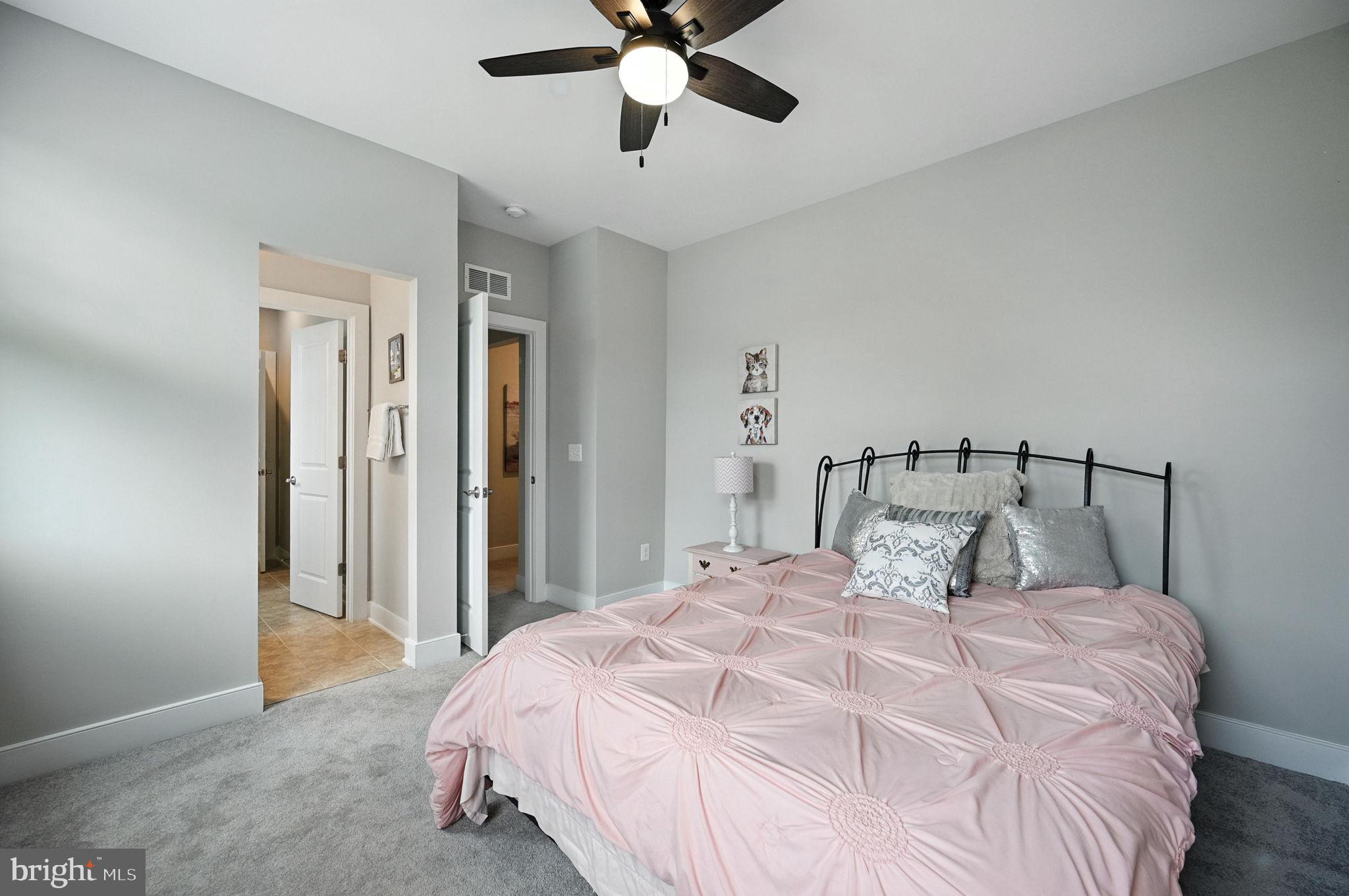 40960 River Cane Place Aldie, VA 20105 - Photo 40 of 54 a bedroom with a bed and closet