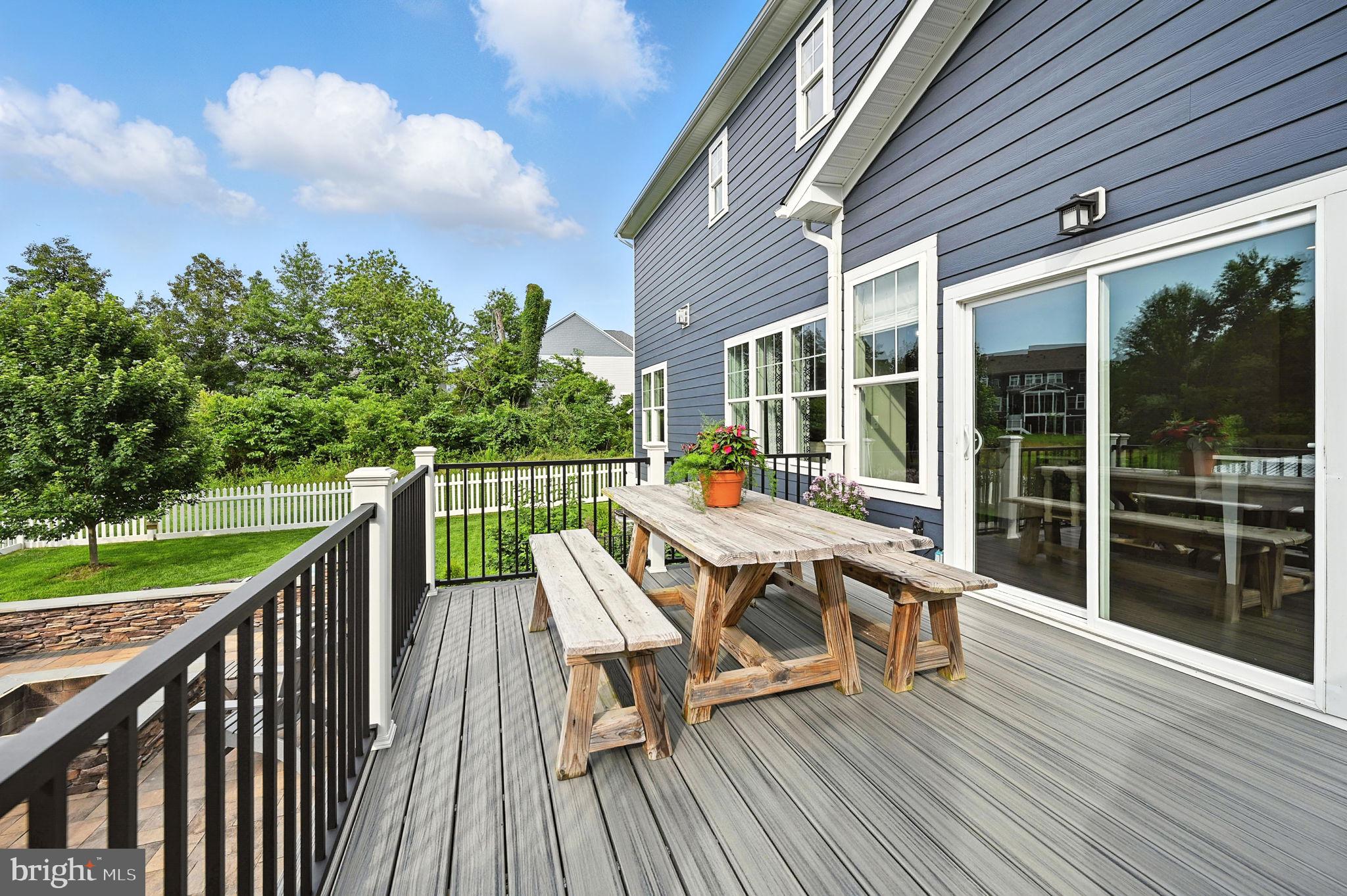 40960 River Cane Place Aldie, VA 20105 - Photo 45 of 54 a balcony with wooden floor and outdoor seating