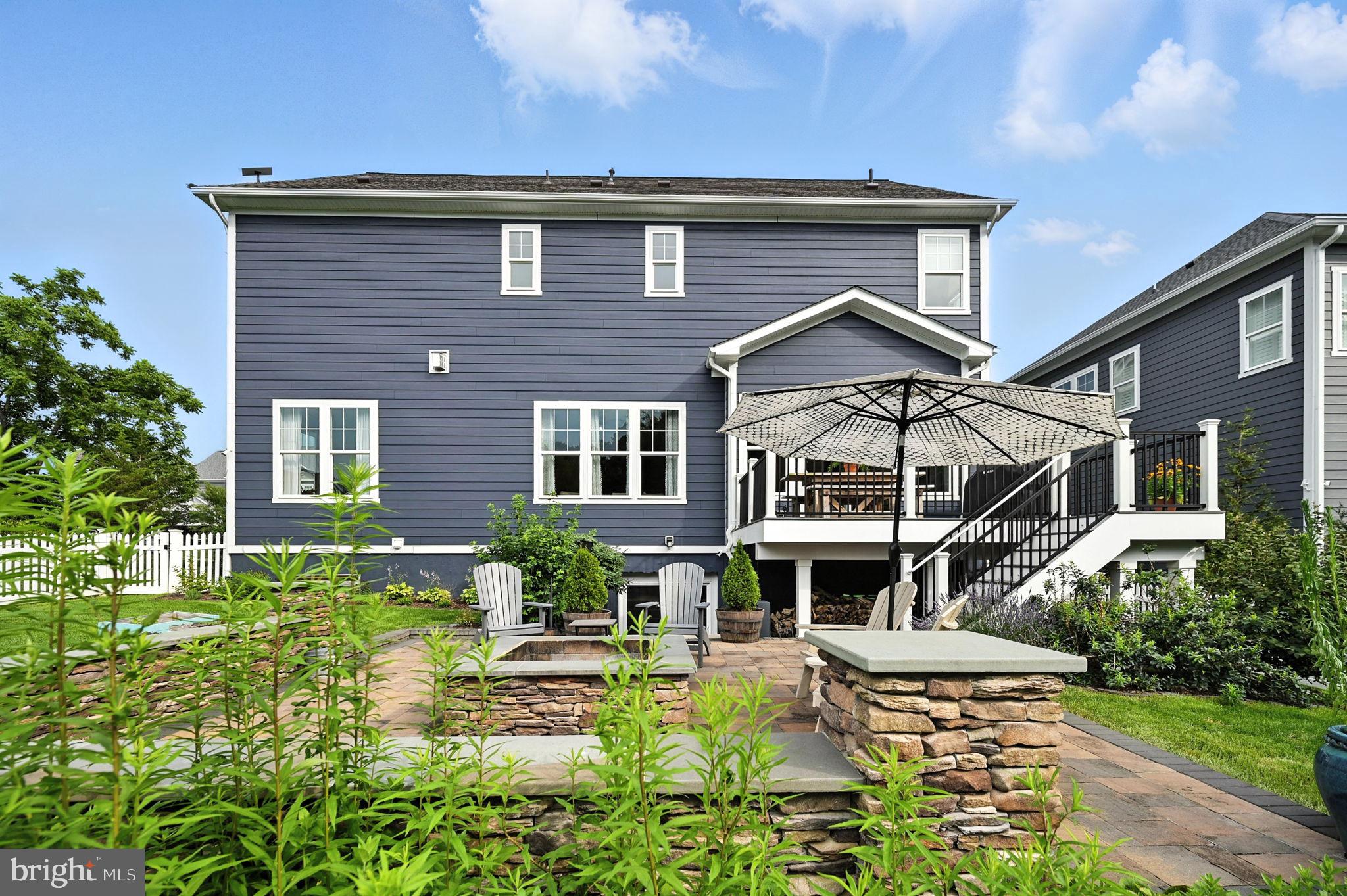 40960 River Cane Place Aldie, VA 20105 - Photo 50 of 54 a front view of a house with garden