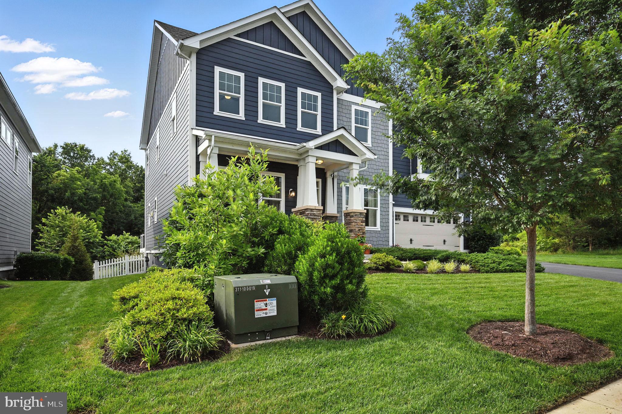 40960 River Cane Place Aldie, VA 20105 - Photo 54 of 54 a front view of a house with a garden