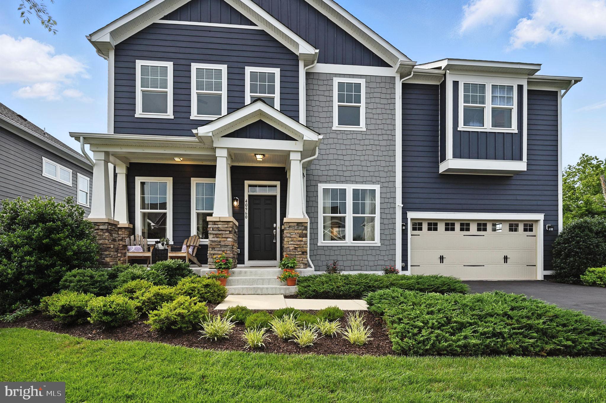 40960 River Cane Place Aldie, VA 20105 - Photo 10 of 54 a front view of a house with a yard