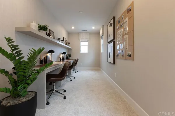 a workspace with furniture and a potted plant