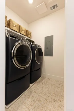 a utility room with dryer and washer