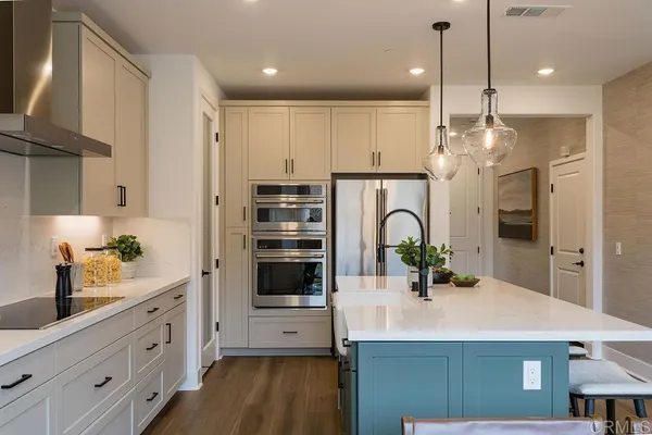 a kitchen with counter top space and cabinets