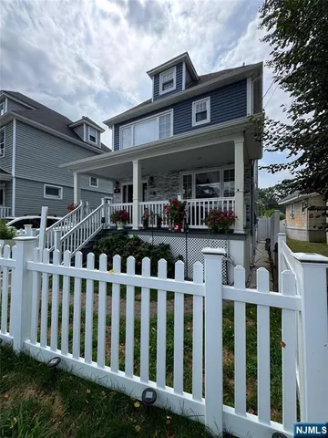 a front view of a house with a small yard