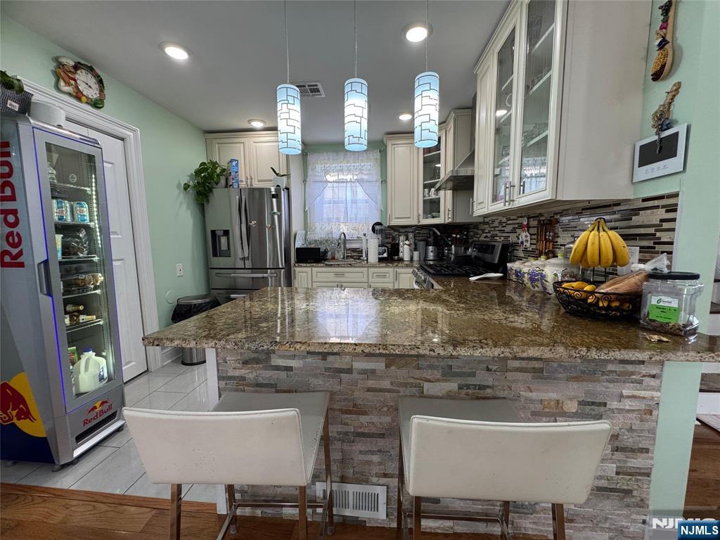 17 Elm Street Ridgefield Park, NJ 07660 - Photo 3 of 15 a kitchen with counter top space and appliances