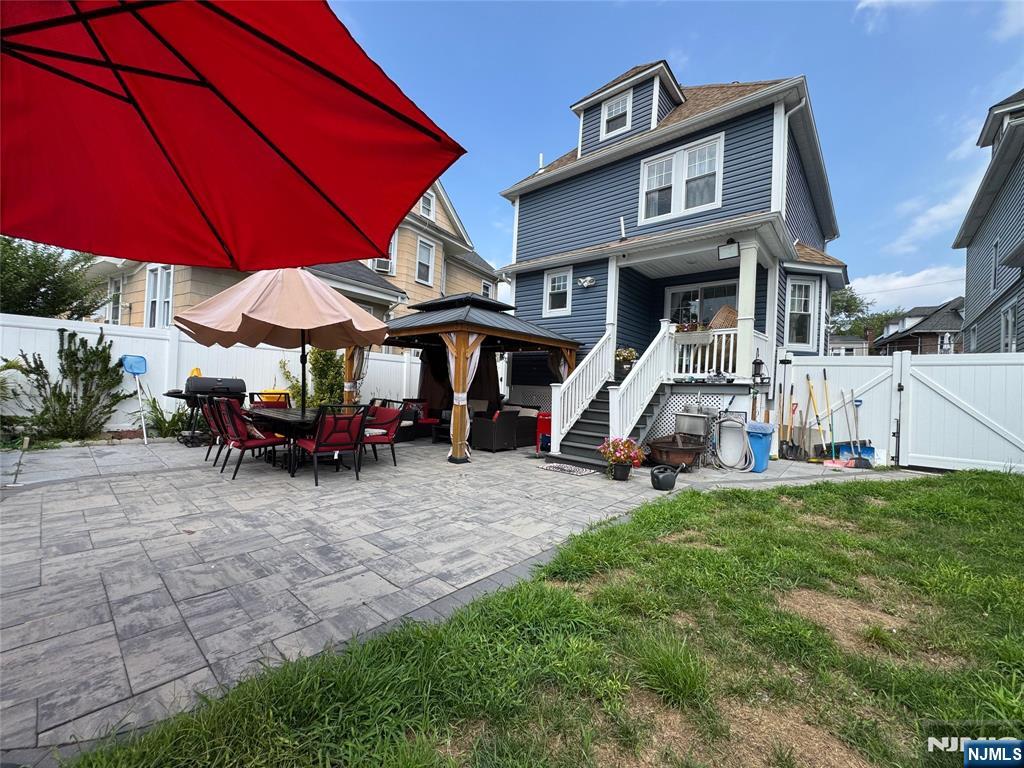 17 Elm Street Ridgefield Park, NJ 07660 - Photo 6 of 15 a view of a house with a yard and sitting area