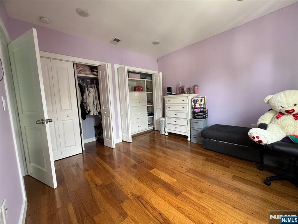 17 Elm Street Ridgefield Park, NJ 07660 - Photo 10 of 15 a hallway with furniture and wooden floor