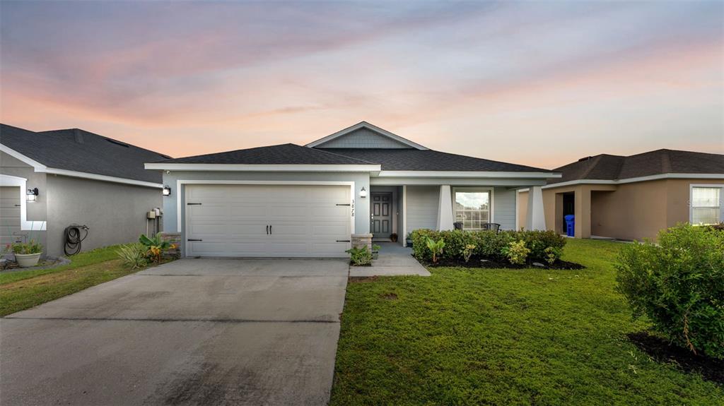 3878 White Ibis Road Lakeland, FL 33811 - Photo 1 of 1 front view of a house with a yard