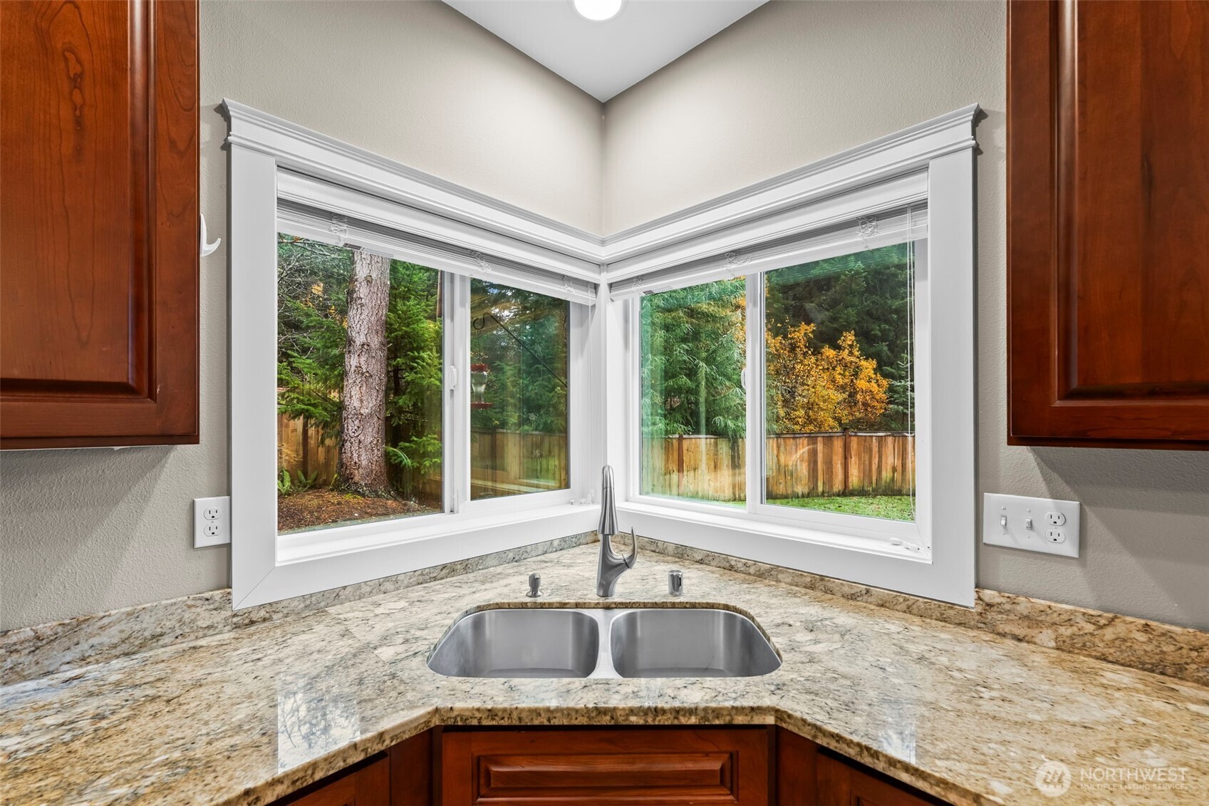 14892 Peacock Hill Road Southeast Olalla, WA 98359 - Photo 14 of 40 a kitchen with granite countertop sink and window