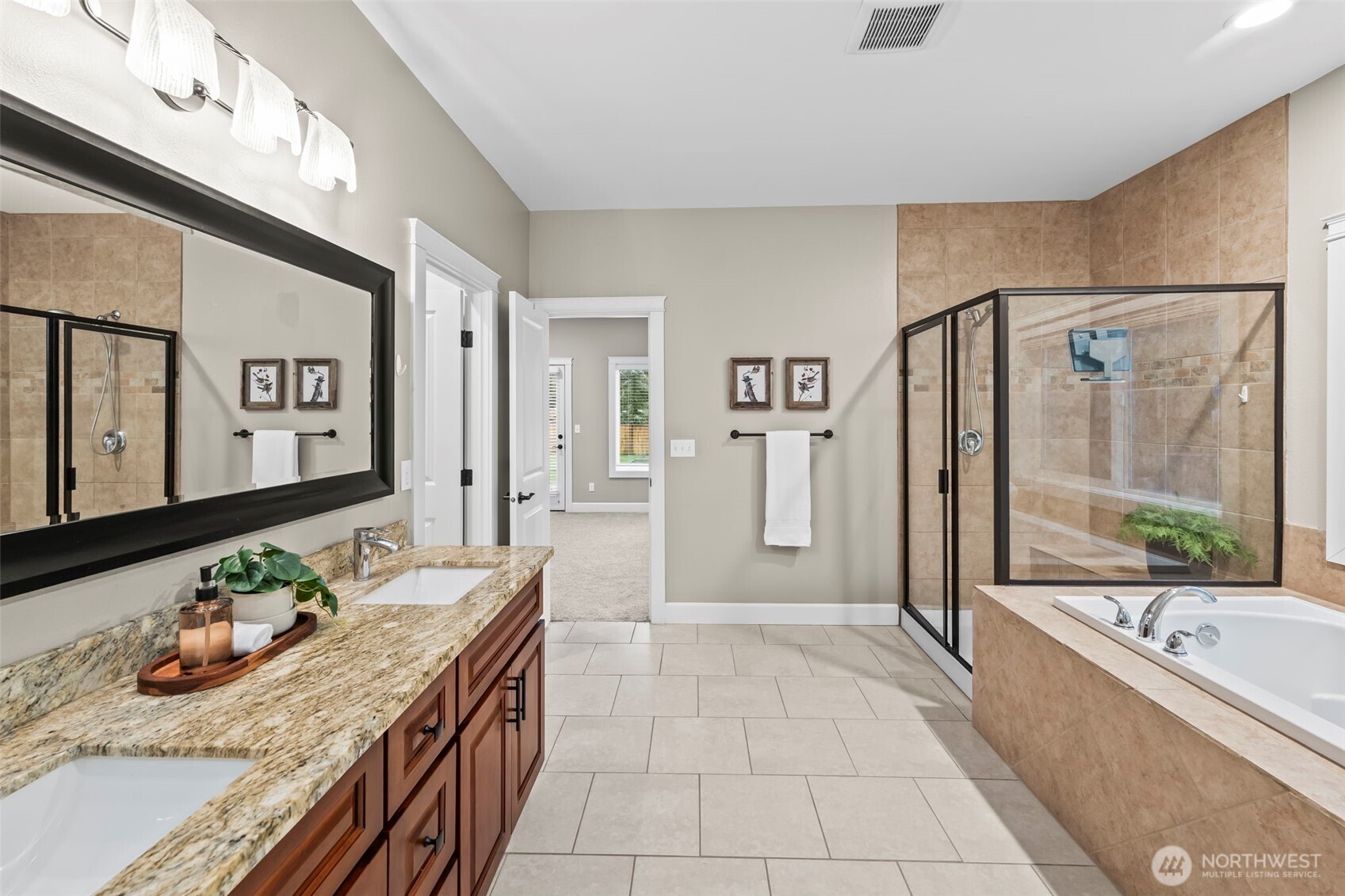 14892 Peacock Hill Road Southeast Olalla, WA 98359 - Photo 23 of 40 a bathroom with a granite countertop sink a mirror a bathtub and shower