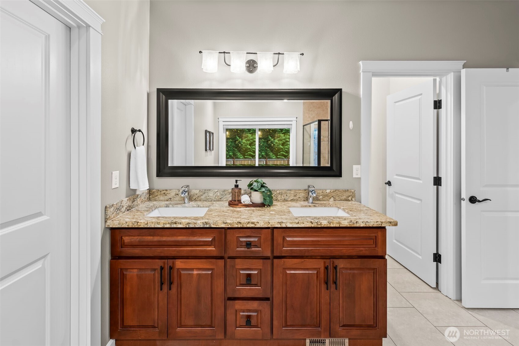 14892 Peacock Hill Road Southeast Olalla, WA 98359 - Photo 26 of 40 a bathroom with a granite countertop sink and a mirror