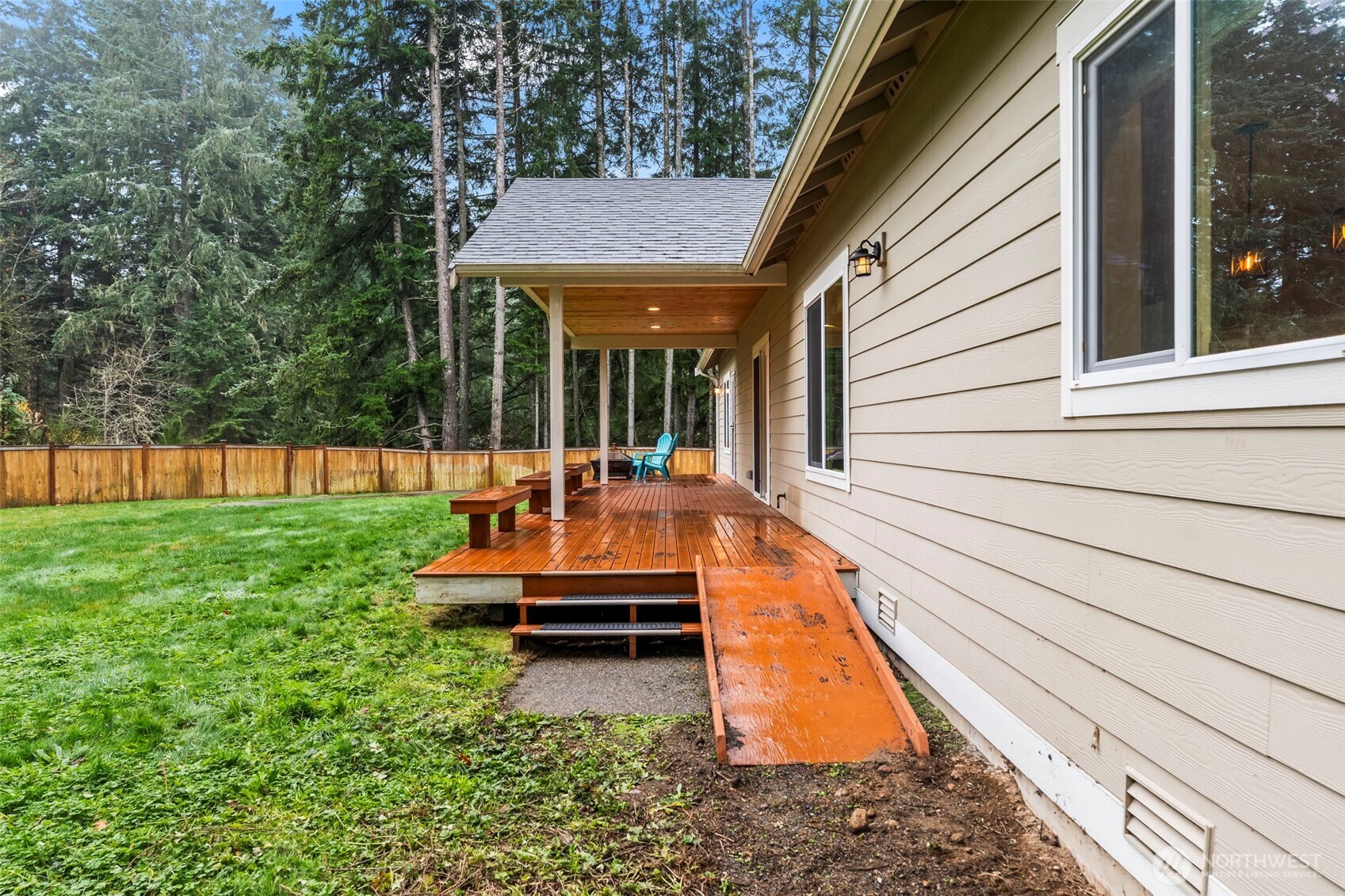 14892 Peacock Hill Road Southeast Olalla, WA 98359 - Photo 33 of 40 a view of a house with backyard porch and sitting area
