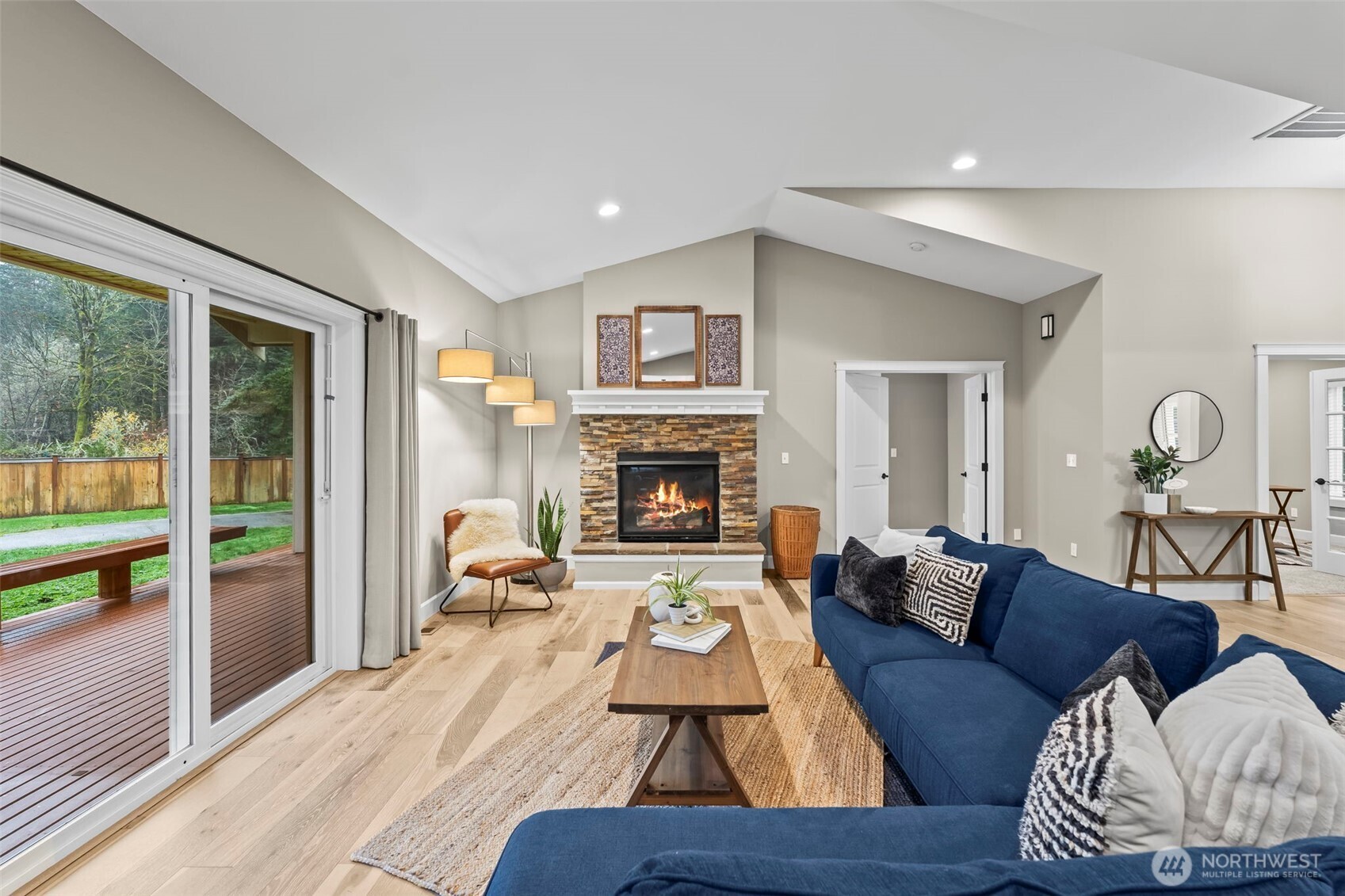 14892 Peacock Hill Road Southeast Olalla, WA 98359 - Photo 8 of 40 a living room with furniture and a fireplace