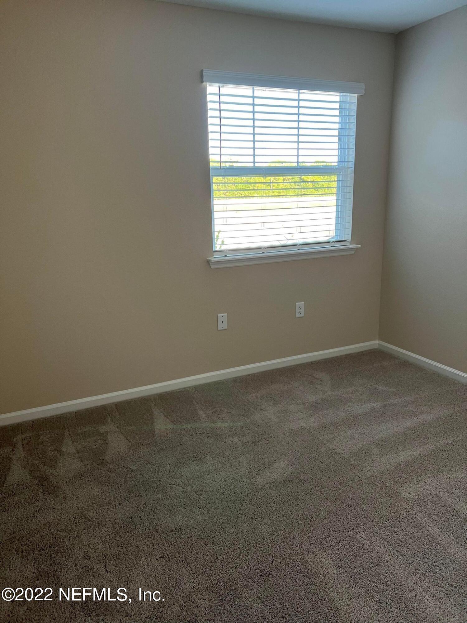 11795 Junegrass Road Jacksonville, FL 32258 - Photo 11 of 15 a view of an empty room with a window
