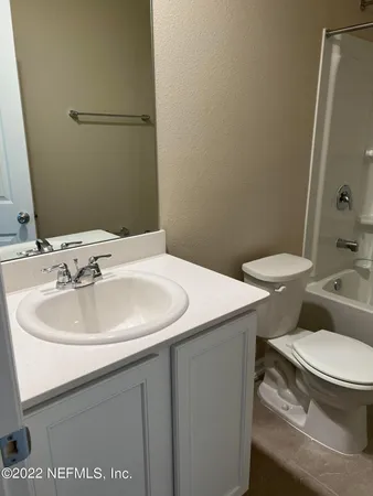 a bathroom with a sink and a toilet