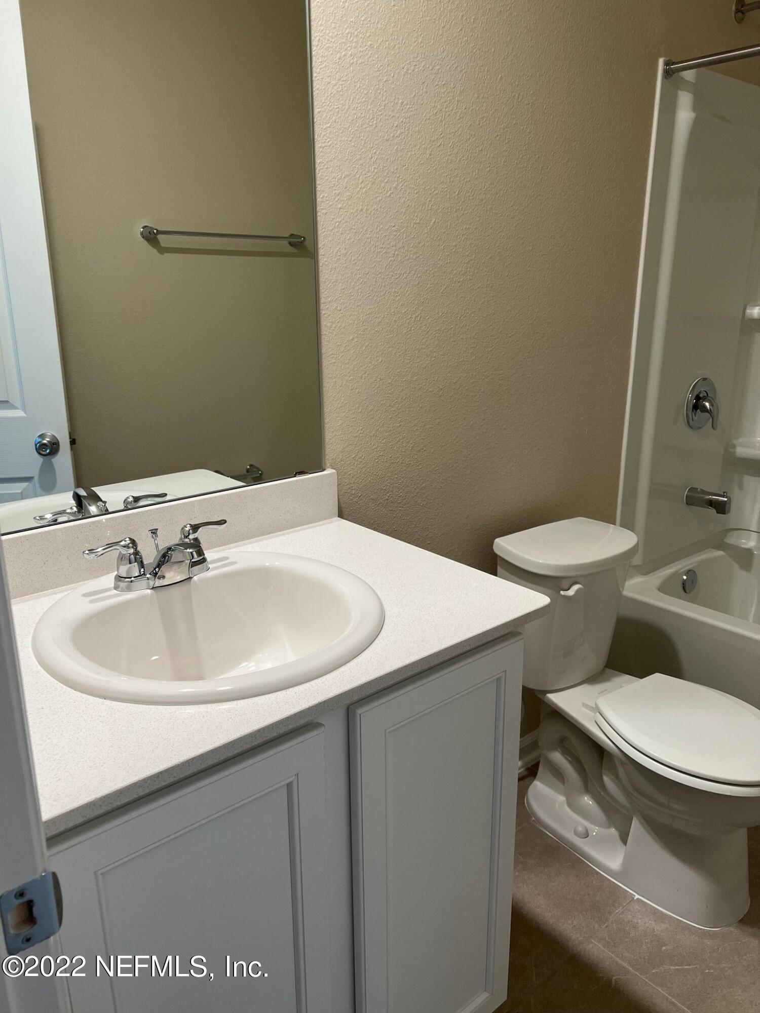 11795 Junegrass Road Jacksonville, FL 32258 - Photo 14 of 15 a bathroom with a sink and a toilet