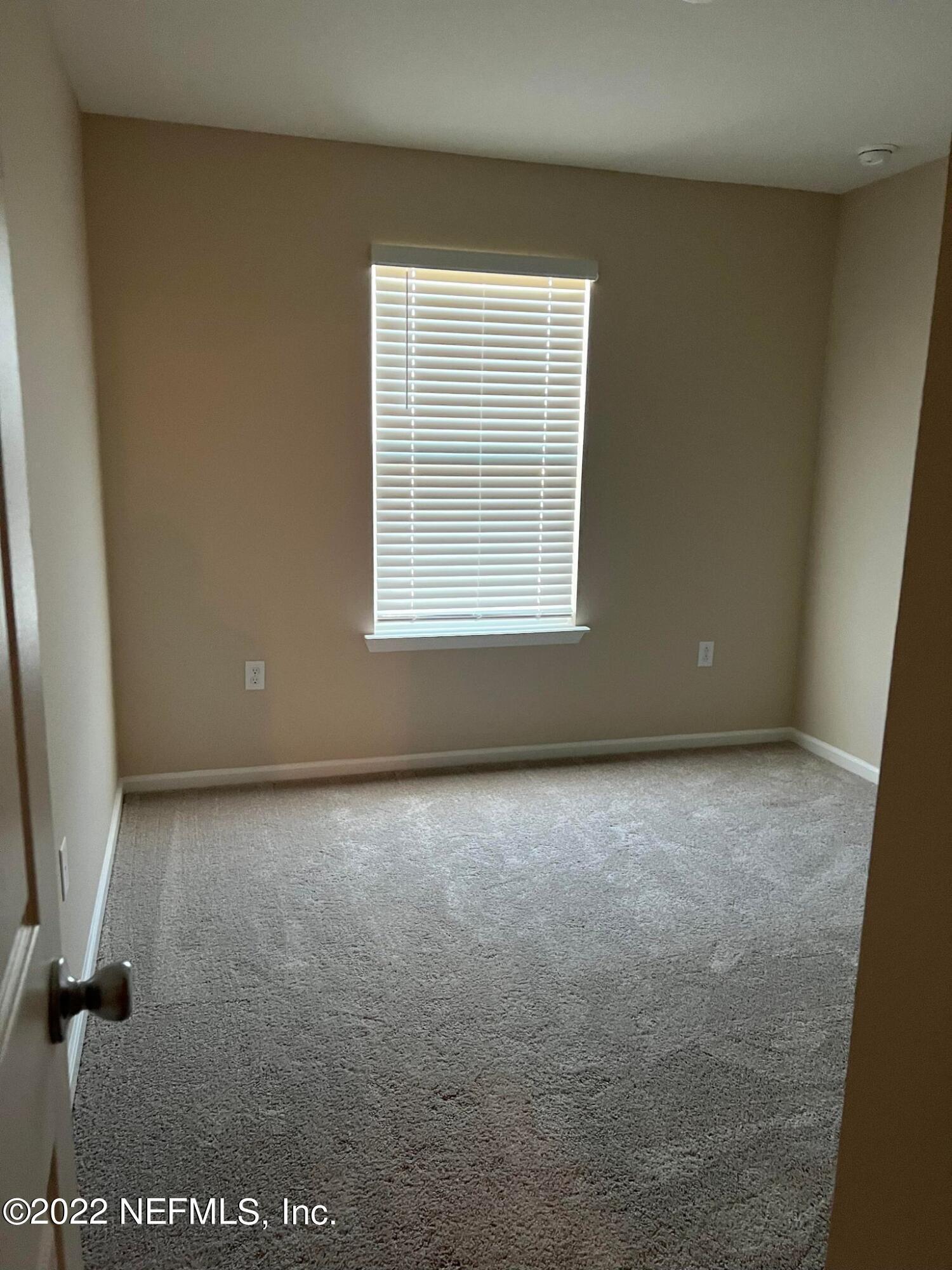11795 Junegrass Road Jacksonville, FL 32258 - Photo 8 of 15 an empty room with a window