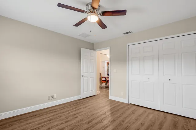a bathroom with double vanity sink a bathtub and window