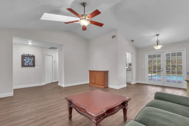a living room with furniture and a window