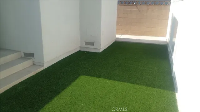 a view of yard from a hall