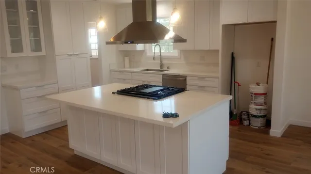 a kitchen with a stove and a refrigerator