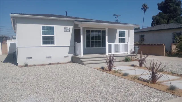 a view of a house with couches in front of house