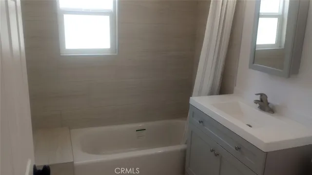 a bathroom with a sink and a bathtub
