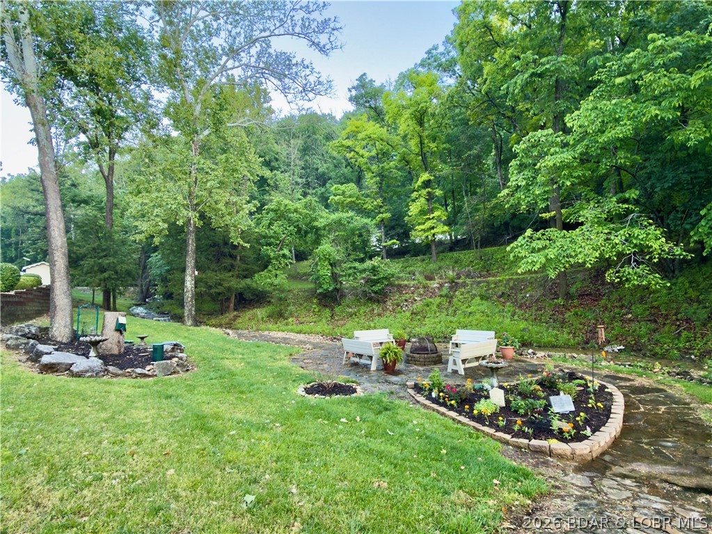 562 Hyd A Way Road, Unit 3E Camdenton, MO 65020 - Photo 33 of 38 Beautiful fire pit garden
