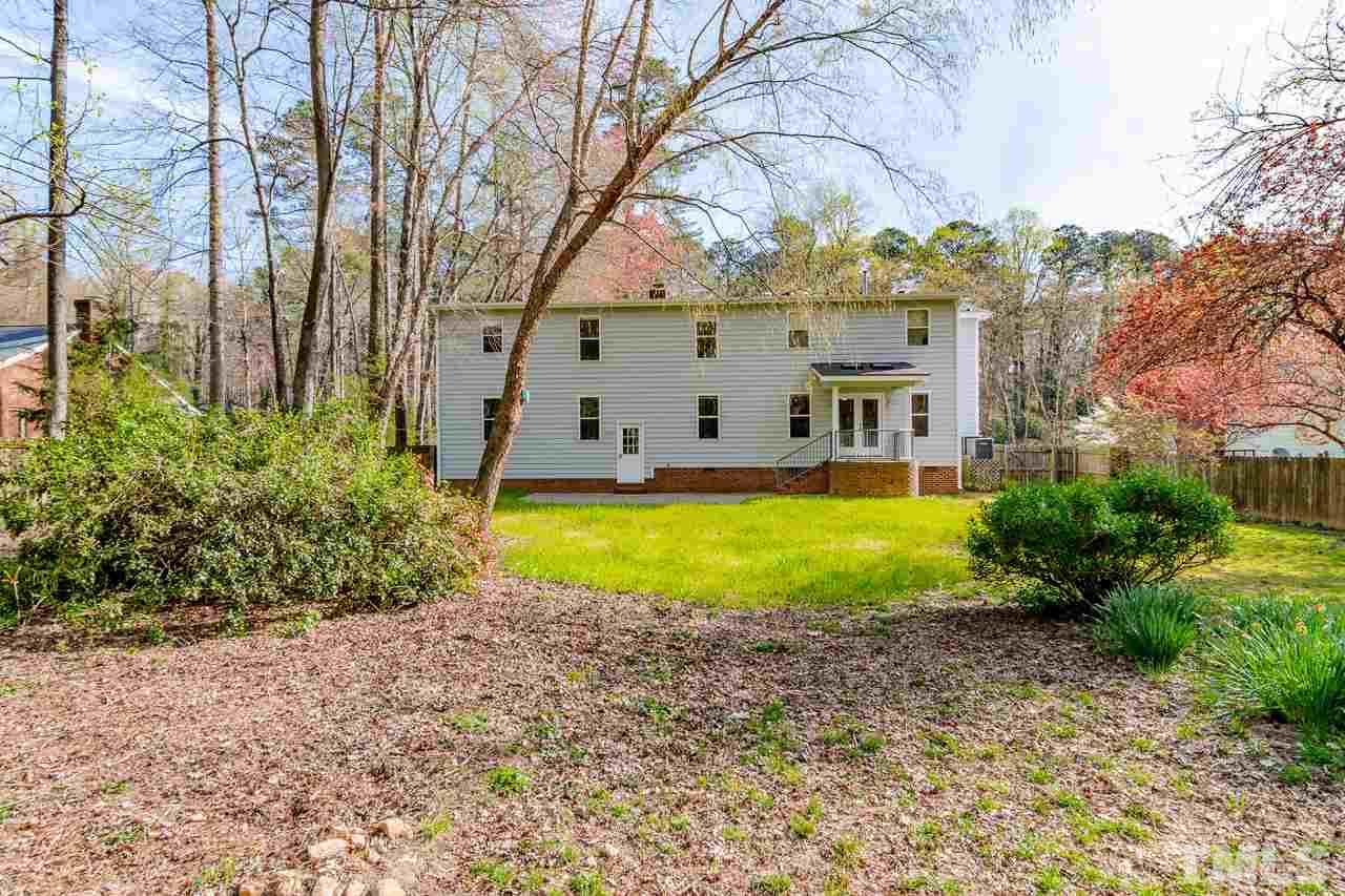 1404 Onslow Road Raleigh, NC 27606 - Photo 2 of 30 a view of house with a big yard and large trees