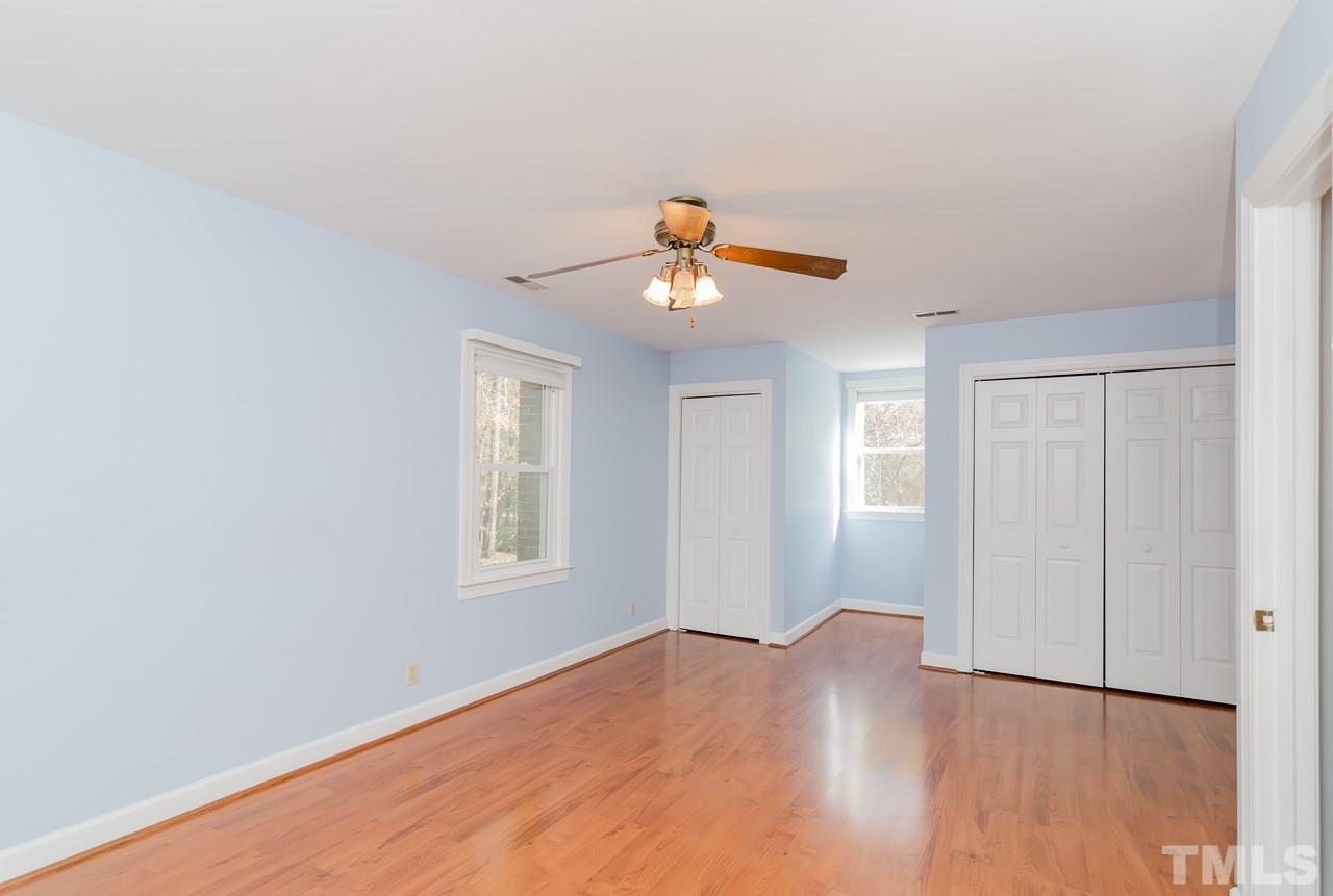 1404 Onslow Road Raleigh, NC 27606 - Photo 12 of 30 a view of an empty room with wooden floor and a window
