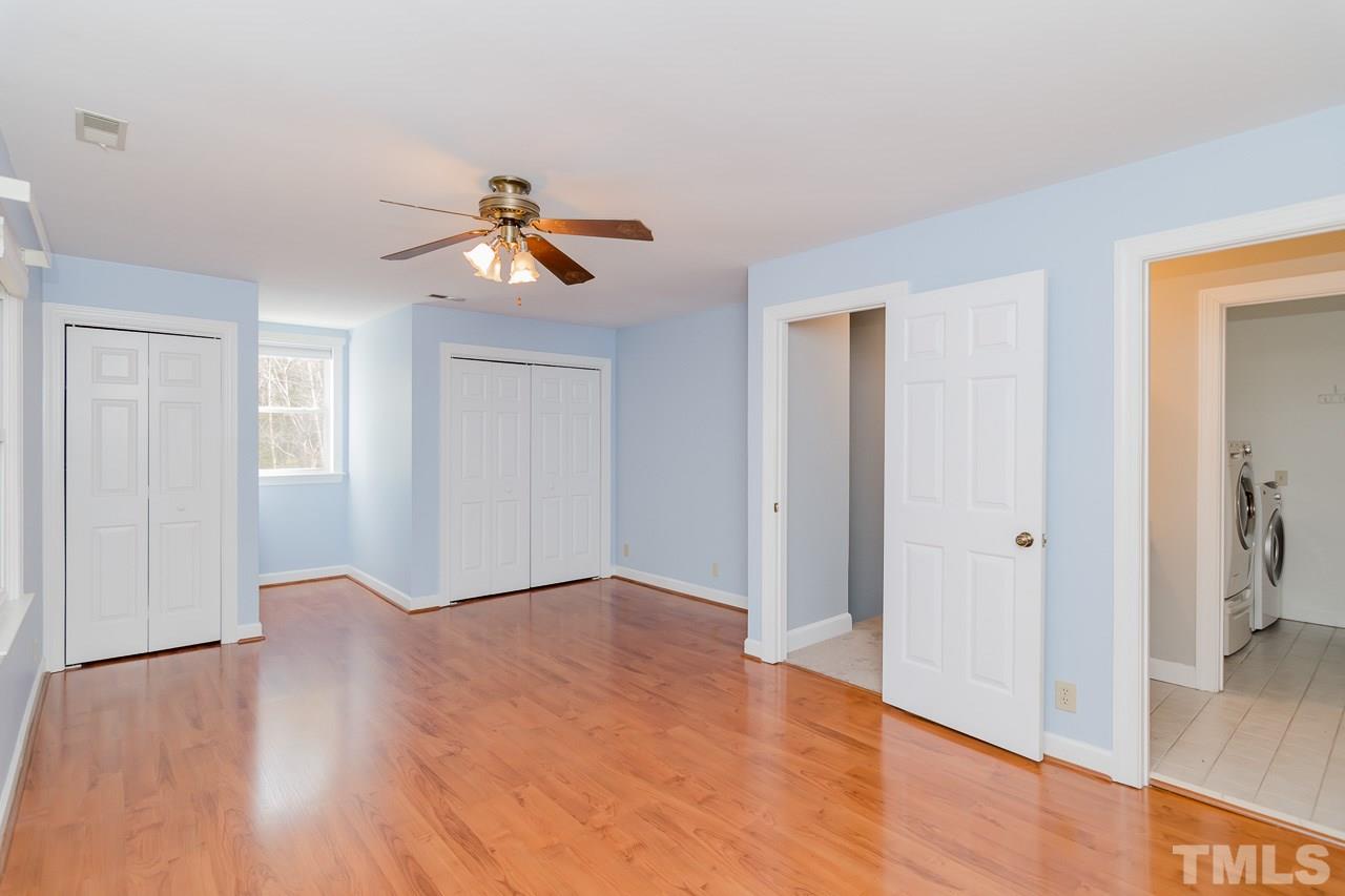 1404 Onslow Road Raleigh, NC 27606 - Photo 13 of 30 a view of a room with wooden floor and a ceiling fan
